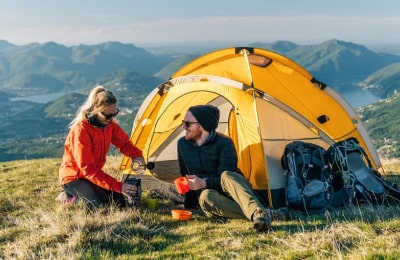 Camper using survival kits and emergency supplies from our survival gear online store