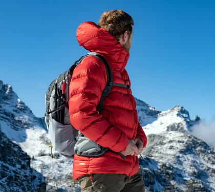 Outdoor jacket designed for hiking clothing, paired with a survival gear kit and hiking backpack for rugged adventures