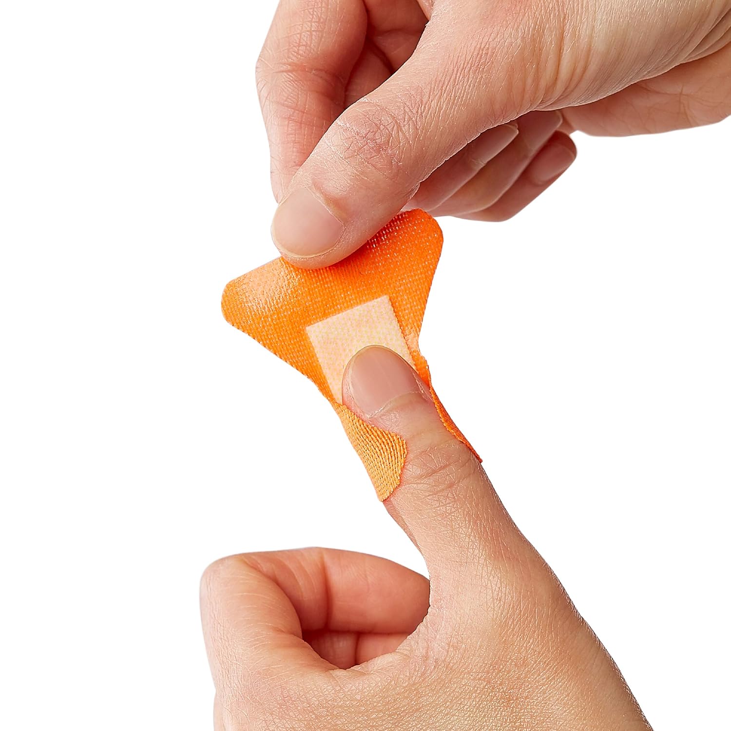 Person applying CURAD antibacterial bandages from a hiking emergency kit during outdoor adventure or backpacking trip
